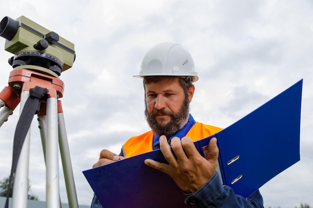 civil-engineer-writes-down-readings-optical-level-piece-paper-folder_1048944-5212704 civil-engineer-writes-down-readings-optical-level-piece-paper-folder_1048944-5212704