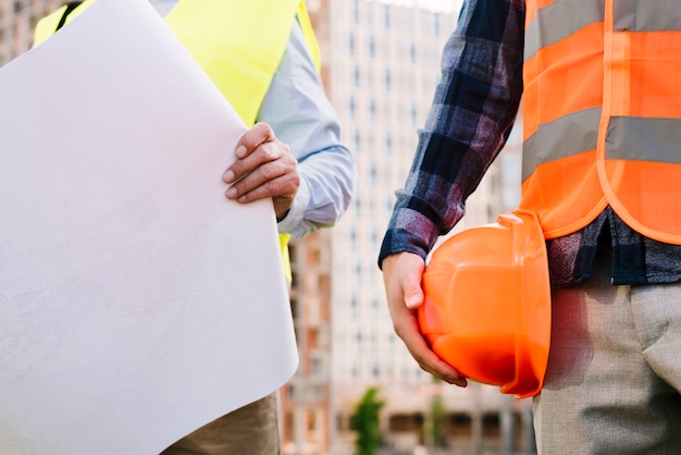 close-up-men-with-safety-vests-helmet_23-2148269362 close-up-men-with-safety-vests-helmet_23-2148269362