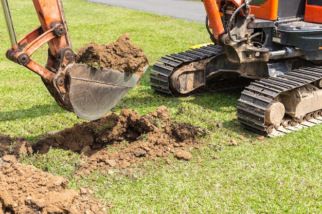 digger-machine-operate-digging-soil-repair-road_30478-135 digger-machine-operate-digging-soil-repair-road_30478-135
