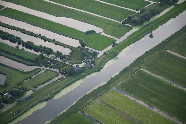 high-angle-shot-water-stream-middle-grassy-field-dutch-polder_181624-19510 high-angle-shot-water-stream-middle-grassy-field-dutch-polder_181624-19510