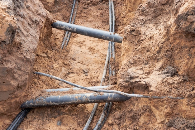 high-voltage-electrical-cable-is-laid-trench-existing-engineering-sewerage-networks-laying-high-voltage-cable-supplying-buildings-with-electricity_331695-3623 high-voltage-electrical-cable-is-laid-trench-existing-engineering-sewerage-networks-laying-high-voltage-cable-supplying-buildings-with-electricity_331695-3623