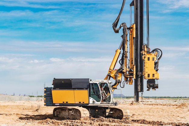 hydraulic-drilling-machine-construction-site-pile-field-modern-drilling-rig-device-piles-background-blue-sky-work-drilling-rig-when-driving-bored-piles_331695-5281 hydraulic-drilling-machine-construction-site-pile-field-modern-drilling-rig-device-piles-background-blue-sky-work-drilling-rig-when-driving-bored-piles_331695-5281