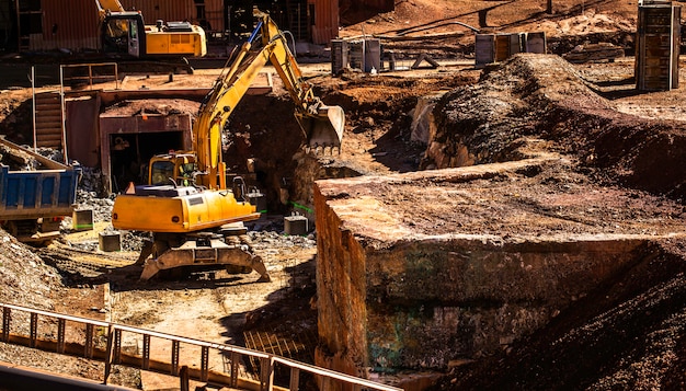 hydraulic-excavator-wheel-backhoe-working-mining-industry_115058-231 hydraulic-excavator-wheel-backhoe-working-mining-industry_115058-231