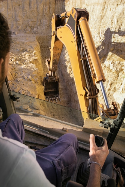 man-using-excavator-digging-day-light_23-2149194778 man-using-excavator-digging-day-light_23-2149194778