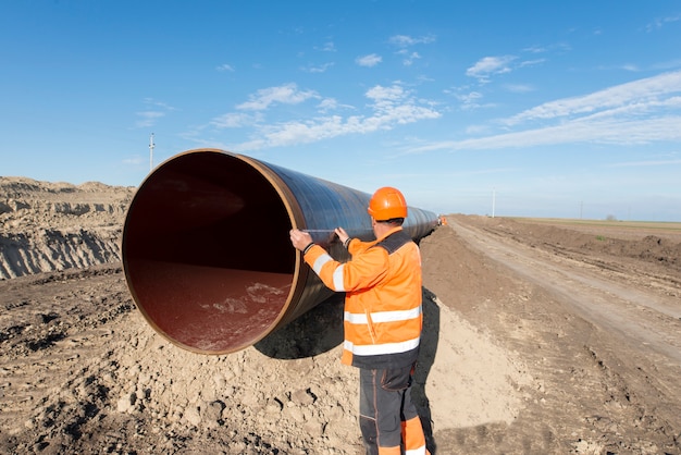 pipeline-workers-measuring-tube-length-construction-gas-oil-pipes_342744-48 pipeline-workers-measuring-tube-length-construction-gas-oil-pipes_342744-48