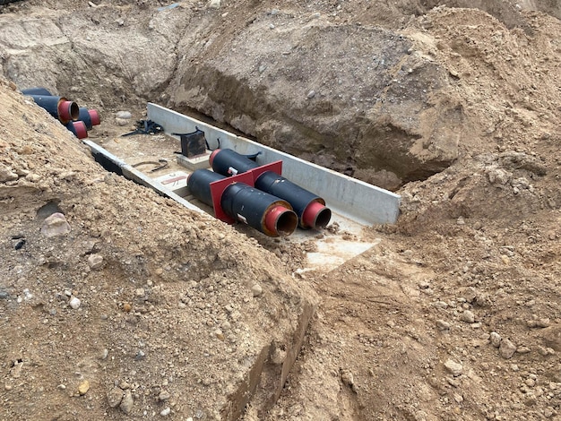 pipes-trench-industrial-pipeline-insulated-pipes-connect-new-buildings-heat-system_75563-6850 pipes-trench-industrial-pipeline-insulated-pipes-connect-new-buildings-heat-system_75563-6850