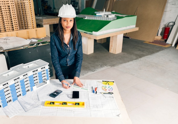 serious-african-american-lady-safety-helmet-standing-near-model-building-table_23-2148039867 serious-african-american-lady-safety-helmet-standing-near-model-building-table_23-2148039867