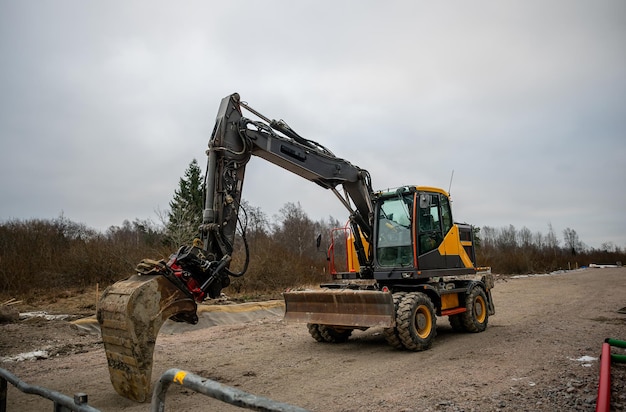 yellow-wheeled-excavator-with-large-bucket-attachment-construction-site_673124-3347 yellow-wheeled-excavator-with-large-bucket-attachment-construction-site_673124-3347